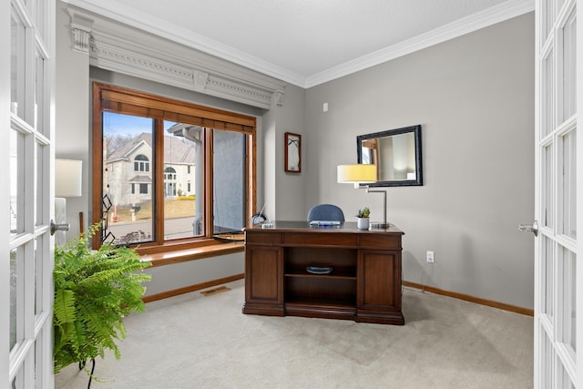 office space with baseboards, visible vents, ornamental molding, and light colored carpet