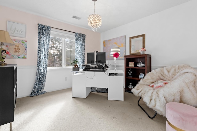 office space with visible vents, a notable chandelier, and light carpet