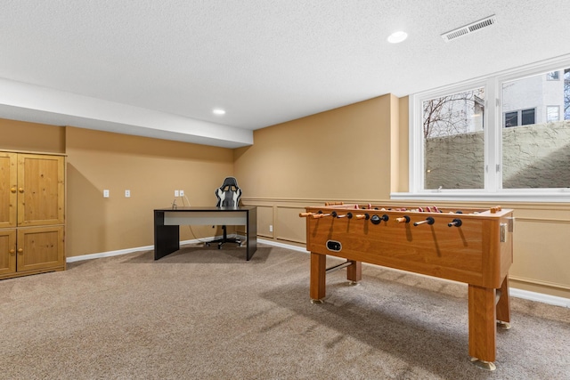 rec room featuring recessed lighting, visible vents, carpet flooring, a textured ceiling, and baseboards