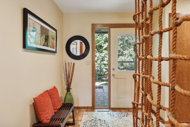 doorway with tile patterned flooring