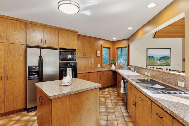 kitchen with a center island, sink, kitchen peninsula, light tile patterned flooring, and black appliances