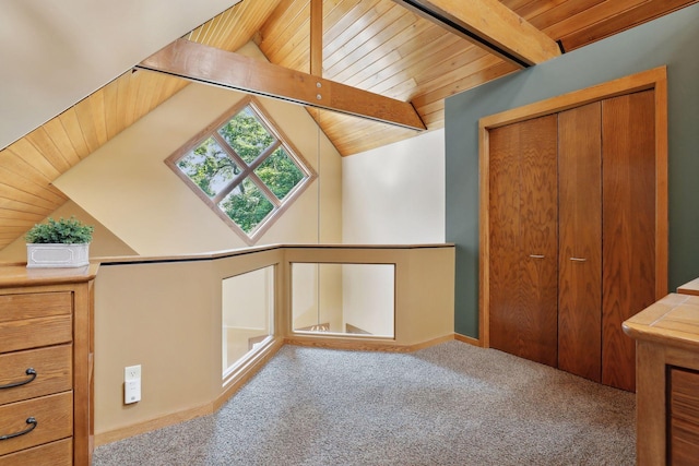 additional living space featuring vaulted ceiling with beams, wooden ceiling, and light carpet