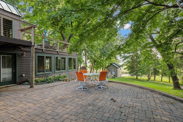 view of patio / terrace with a shed