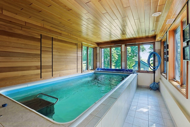 view of pool with an indoor hot tub