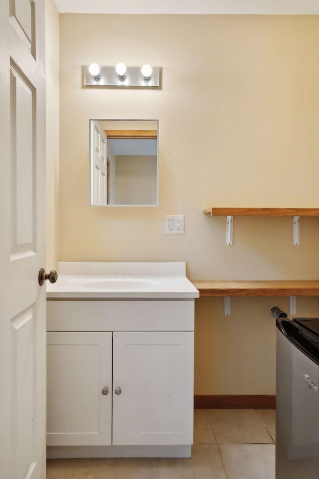 bathroom featuring tile patterned flooring and vanity