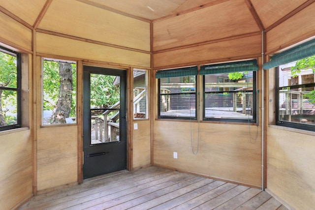 unfurnished sunroom with a wealth of natural light and wood ceiling