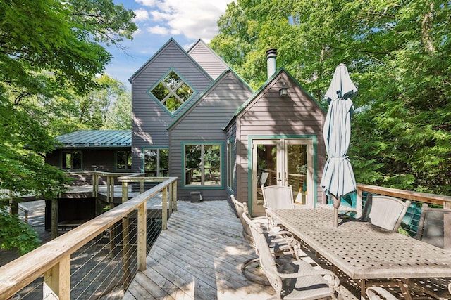 rear view of property featuring a deck