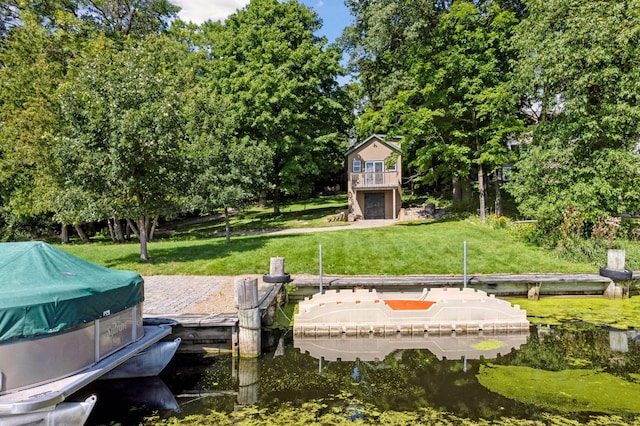 exterior space featuring a boat dock and a water view