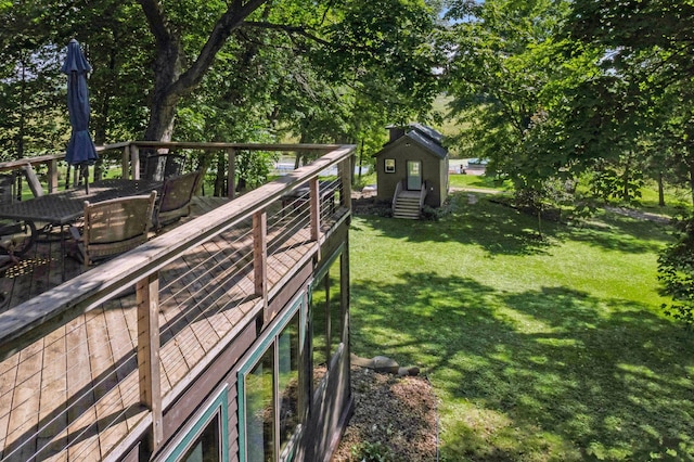 view of yard featuring an outbuilding and a wooden deck