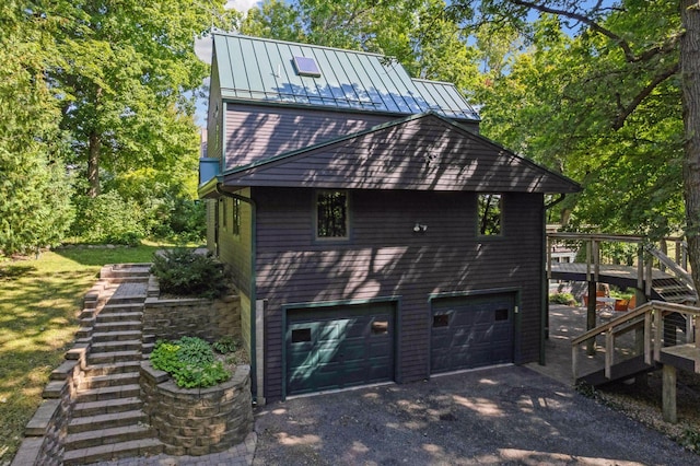 view of side of home with a garage