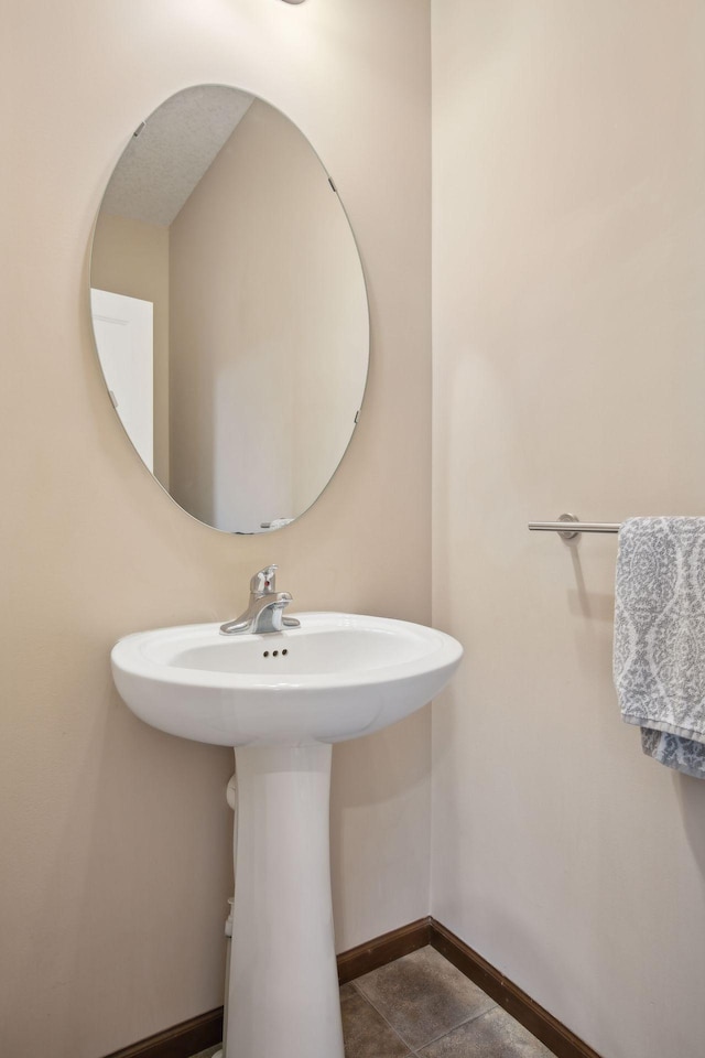 bathroom with sink and tile patterned floors