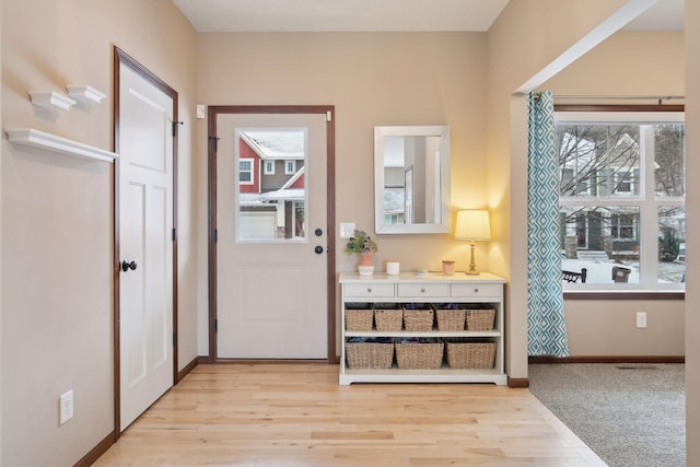 doorway with light hardwood / wood-style floors