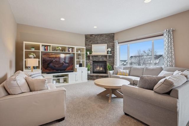 carpeted living room with a fireplace