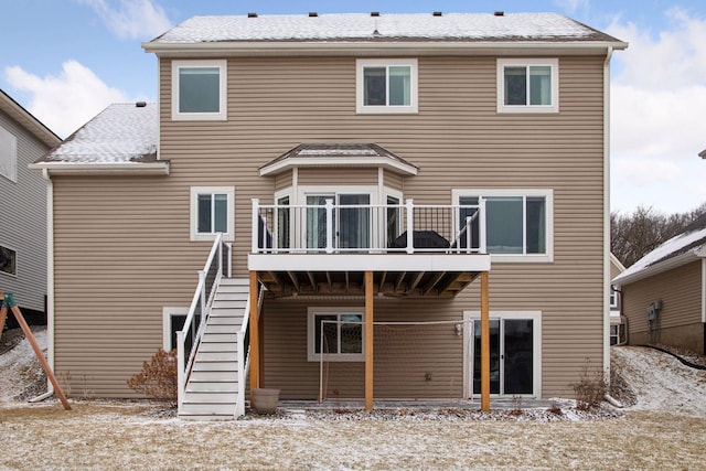 back of house featuring a wooden deck