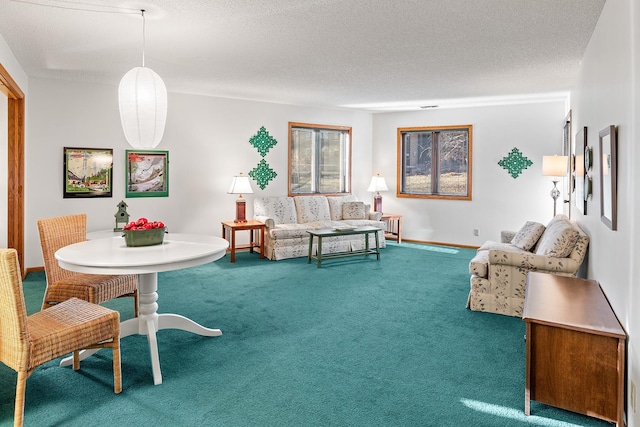 carpeted living room with a textured ceiling