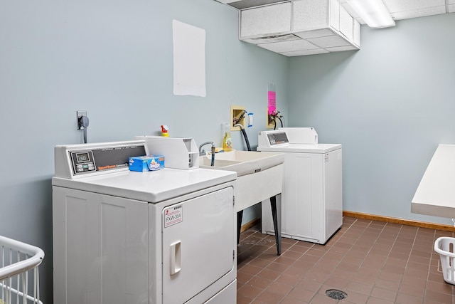 clothes washing area featuring tile patterned floors and independent washer and dryer