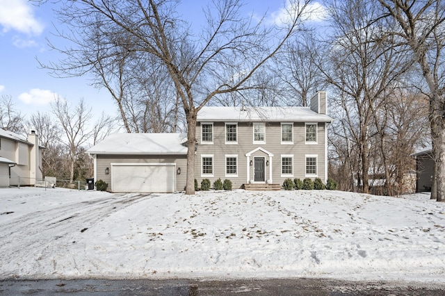 colonial house featuring a garage