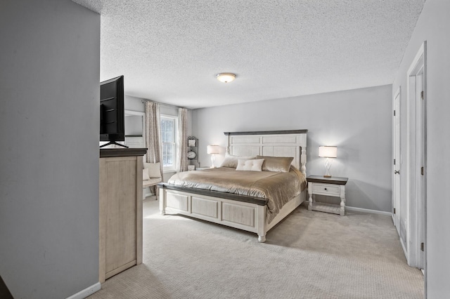 carpeted bedroom featuring a textured ceiling