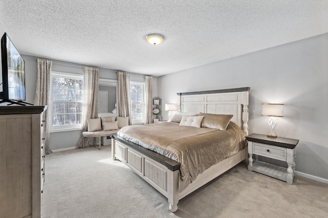 carpeted bedroom with a textured ceiling