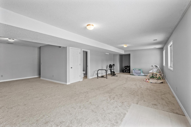 interior space with carpet and a textured ceiling