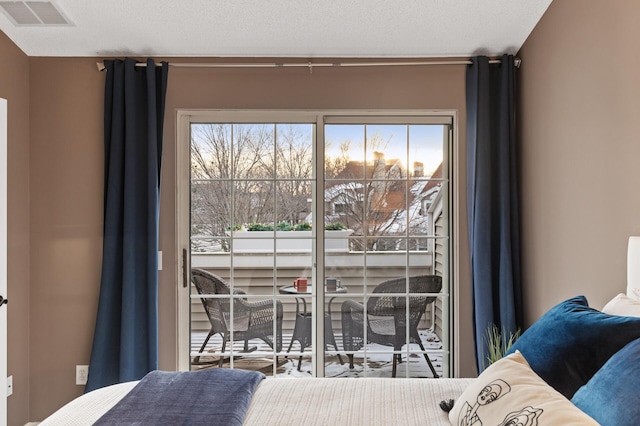 bedroom with multiple windows