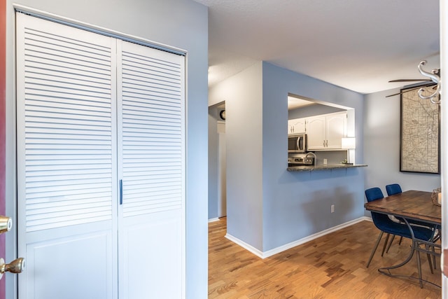 dining room featuring ceiling fan and light hardwood / wood-style floors