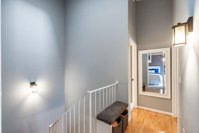 corridor with light hardwood / wood-style flooring