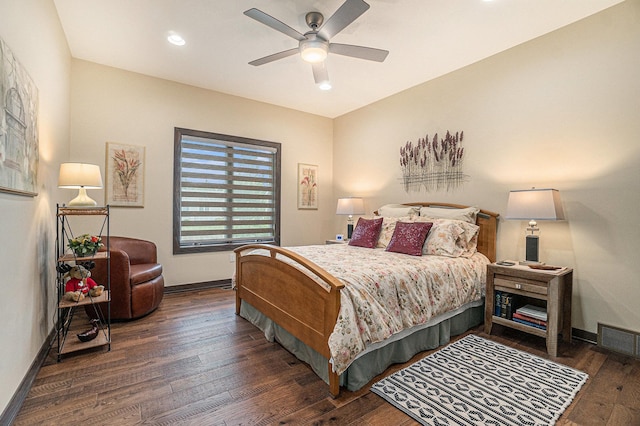 bedroom with ceiling fan and dark hardwood / wood-style flooring