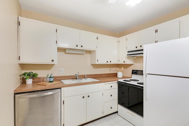 kitchen featuring freestanding refrigerator, under cabinet range hood, stainless steel dishwasher, a sink, and range with electric stovetop