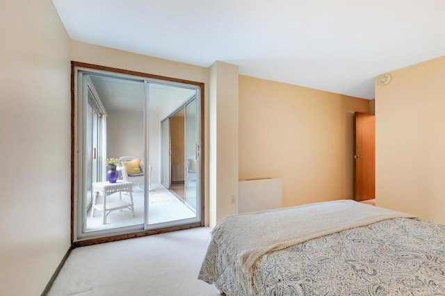 bedroom featuring carpet, baseboards, and access to outside