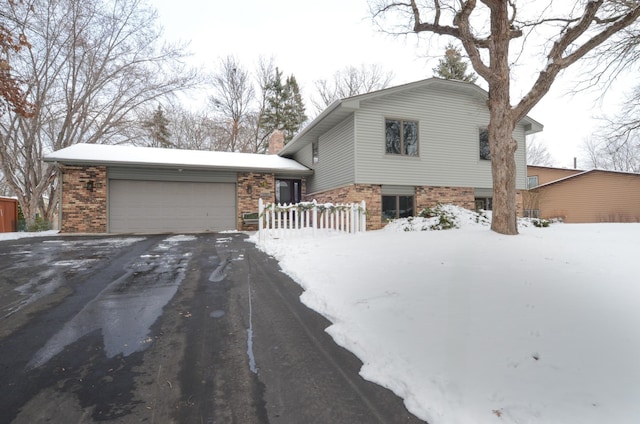 split level home with a garage