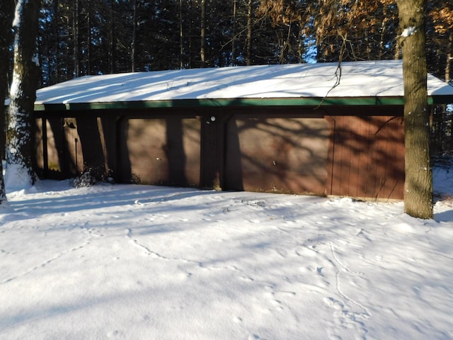 view of snow covered garage