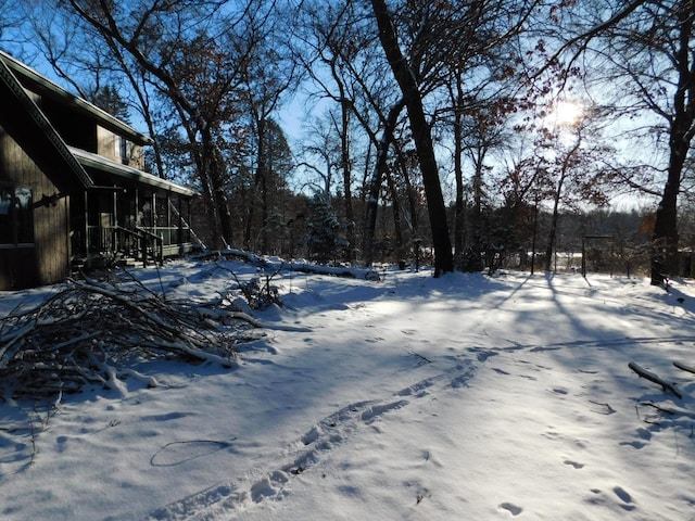 view of yard layered in snow