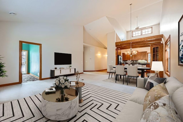 living room with high vaulted ceiling and a chandelier