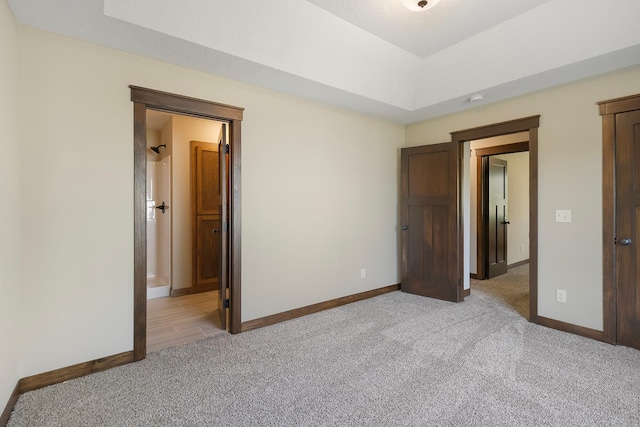 unfurnished bedroom with light carpet