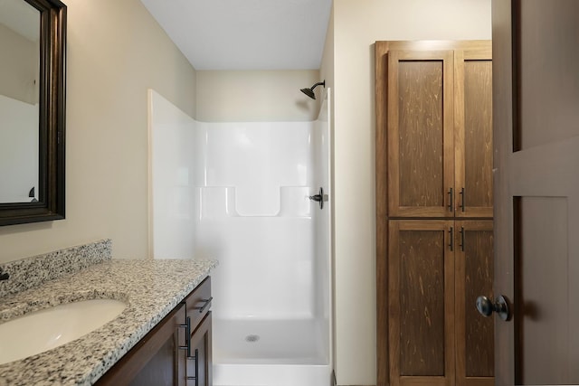 bathroom with vanity and walk in shower