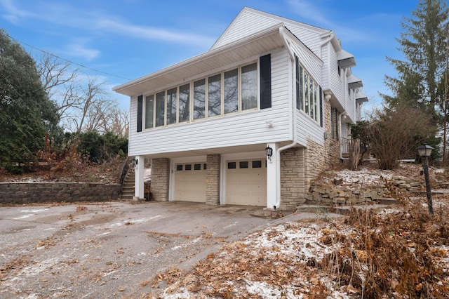 view of side of property with a garage