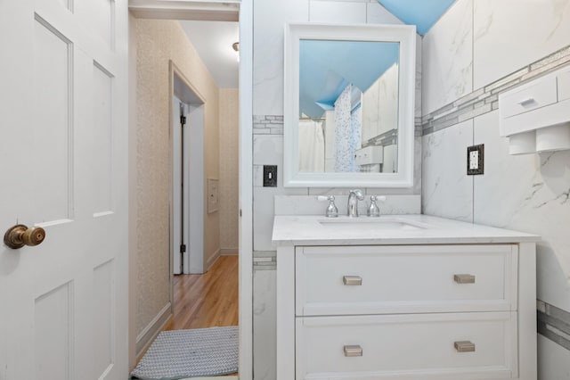 bathroom featuring vanity and hardwood / wood-style flooring