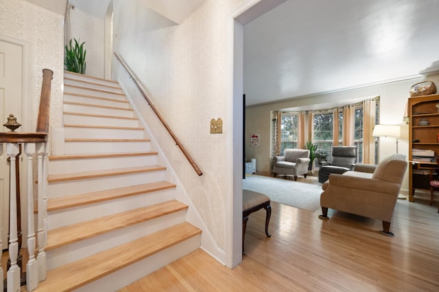 stairway with hardwood / wood-style floors