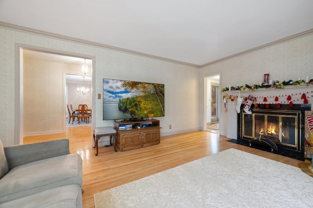 living room featuring ornamental molding and hardwood / wood-style flooring