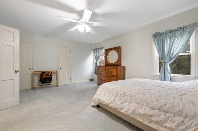 carpeted bedroom featuring ceiling fan