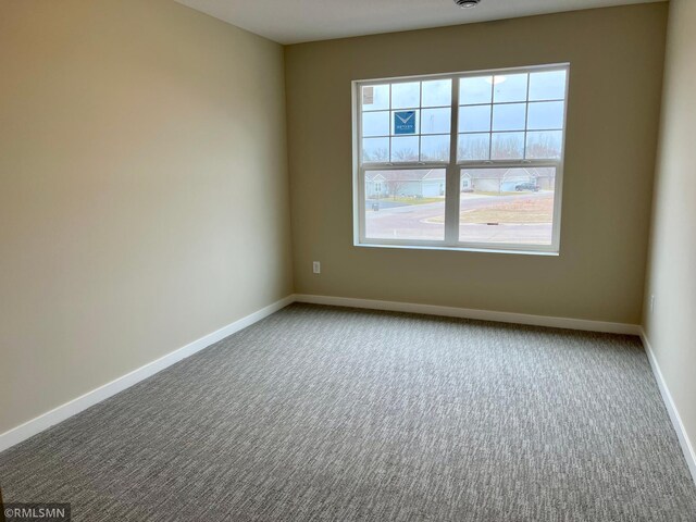 unfurnished room with carpet floors