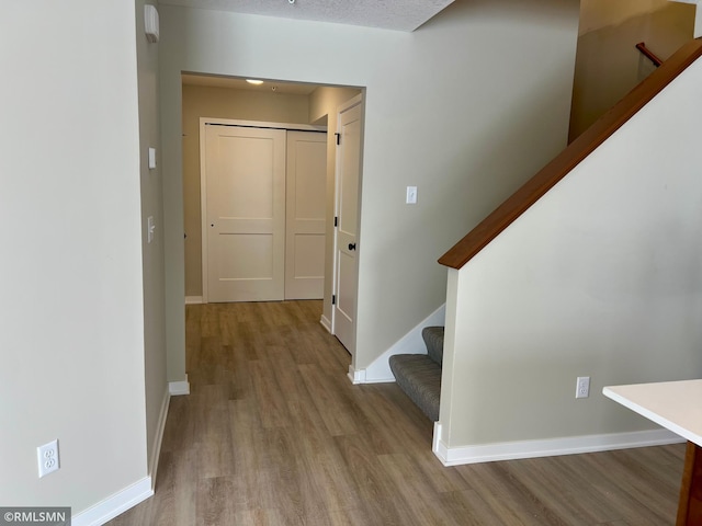 hallway featuring light hardwood / wood-style flooring