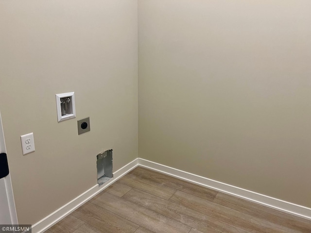 laundry room with washer hookup, wood-type flooring, and electric dryer hookup