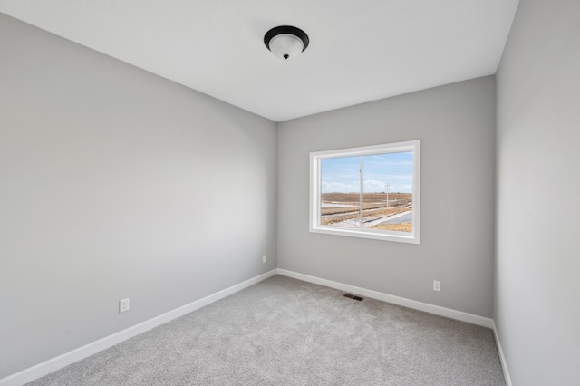 unfurnished room with carpet floors