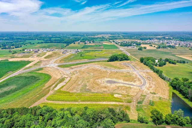 aerial view featuring a rural view and a water view