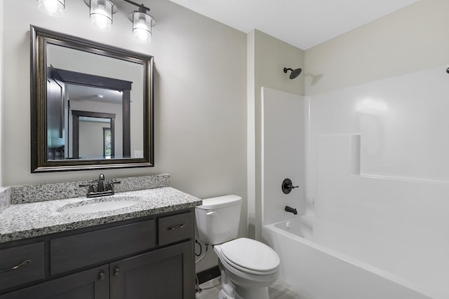 full bathroom with bathtub / shower combination, vanity, and toilet