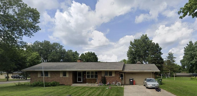 ranch-style house featuring a garage and a front lawn