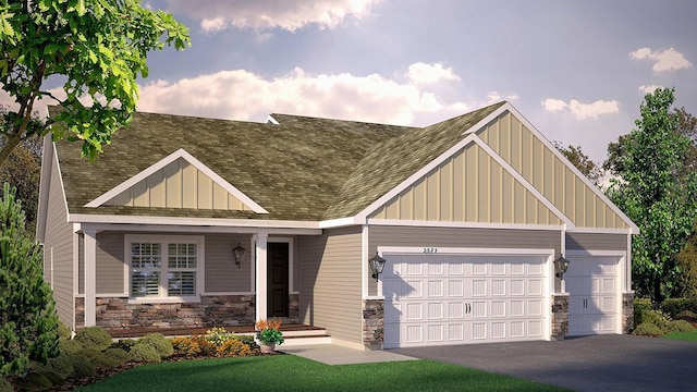 view of front of home with a garage and a front yard