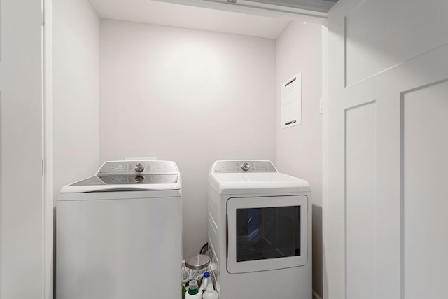 washroom with washing machine and clothes dryer